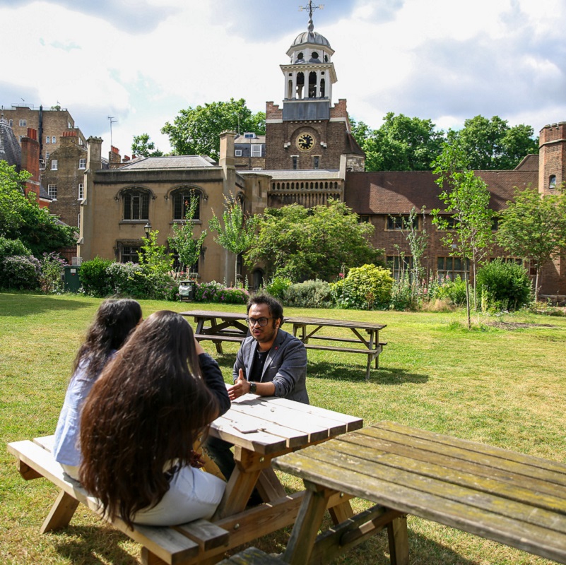 Students on lawn at Charterhouse Square campus